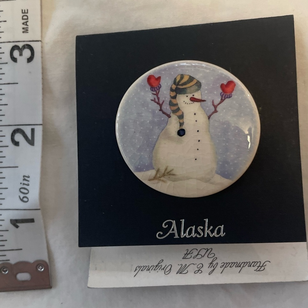 Handcrafted vintage Christmas snowman pin.